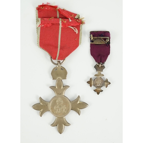 1295 - A cased George V military MBE containing leaflet with instructions as to wearing Insignia, together ... 