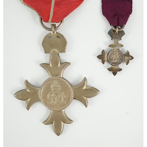 1295 - A cased George V military MBE containing leaflet with instructions as to wearing Insignia, together ... 