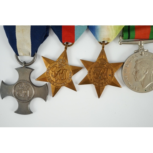 1299 - An unnamed WWII DSC group, including; War Medal with mentioned in despatches oak leaf, Defence Medal... 