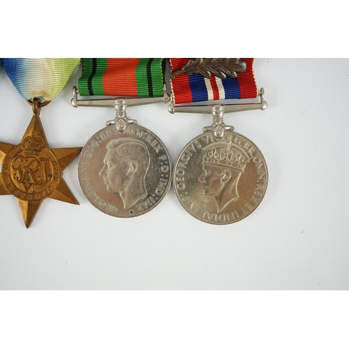 1299 - An unnamed WWII DSC group, including; War Medal with mentioned in despatches oak leaf, Defence Medal... 