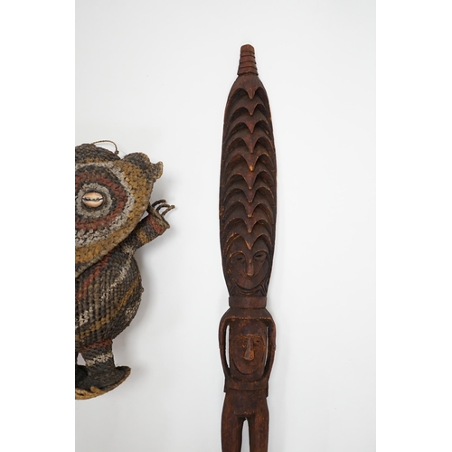 1305 - Two Papua New Guinea figures, a tall carved wooden figure with label reading; Guam or Misingi River... 