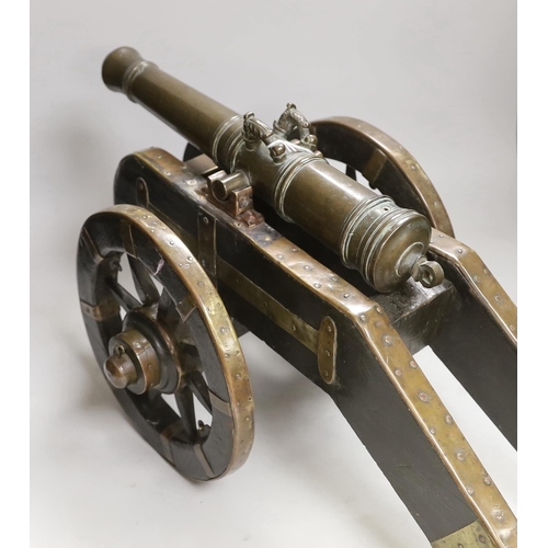 1313 - A bronze starting canon and truck, barrel 37cm