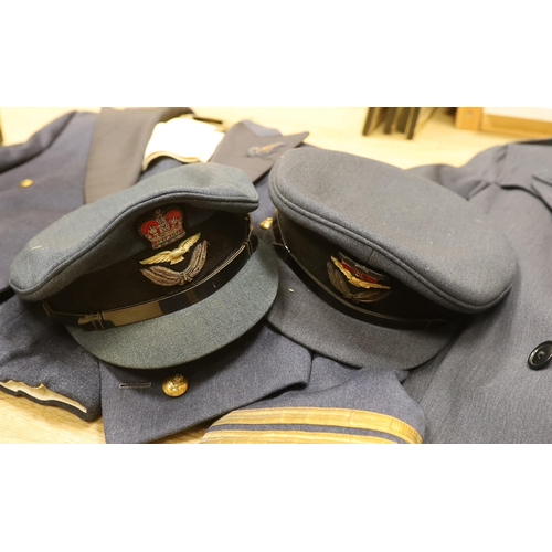 1316 - A collection of post-war RAF uniforms, comprising; two caps, double-breasted overcoat, dress uniform... 