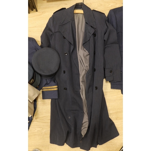 1316 - A collection of post-war RAF uniforms, comprising; two caps, double-breasted overcoat, dress uniform... 