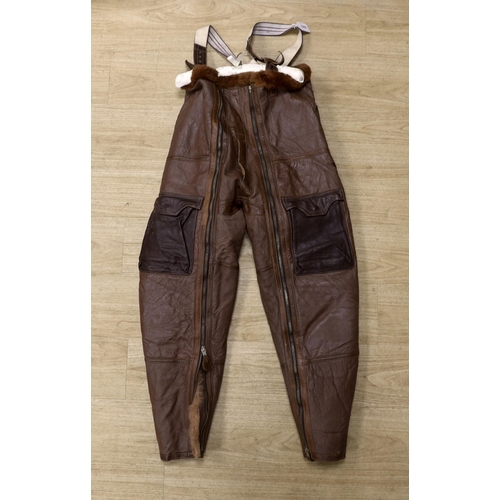 1318 - A pair of WWII Air Ministry issue RAF sheepskin breeches, with original label stating; AM, Size: 5,... 