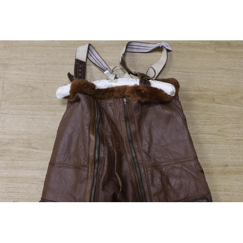 1318 - A pair of WWII Air Ministry issue RAF sheepskin breeches, with original label stating; AM, Size: 5,... 