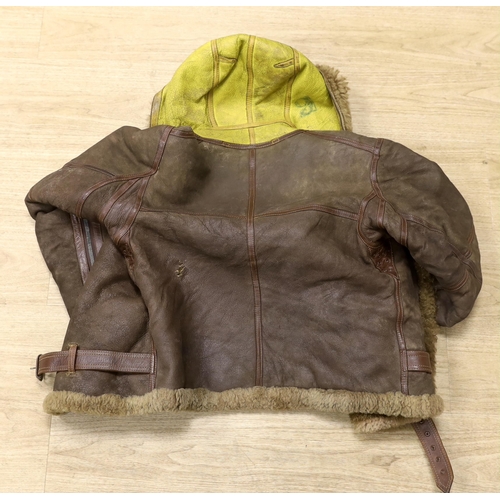 1319 - A WWII Air Ministry issue RAF sheepskin flying jacket, with original label stating; AM Contract No.... 