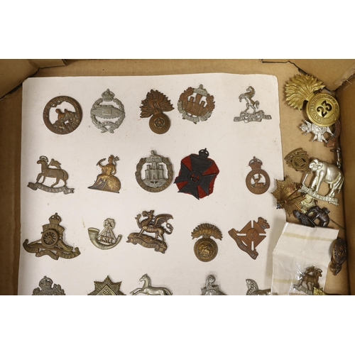 1320 - A collection of military cap badges, including Royal Sussex Reg, Royal Warwickshire, Kings Own Huss... 