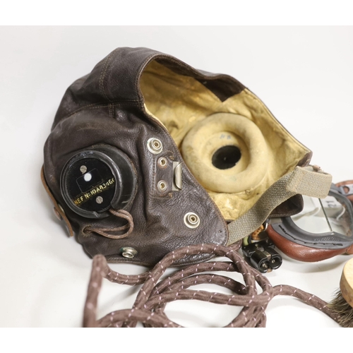 1321 - A WWII RAF flying helmet with speaker earpieces and original cables and plugs, Ref No.10A/13466, ini... 