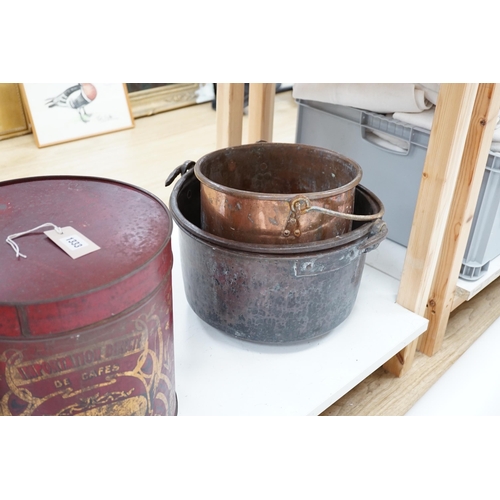 1334 - Two copper cauldrons with swing handles, the largest 43cm wide