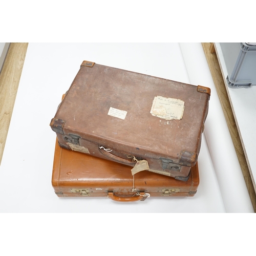 1336 - Two vintage suitcases with various labels including British Railways Waterloo, the largest 61cm wide... 