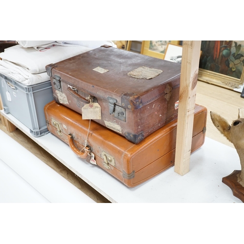 1336 - Two vintage suitcases with various labels including British Railways Waterloo, the largest 61cm wide... 