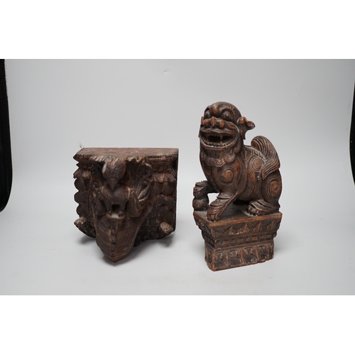 1350 - A carved South East Asian hardwood temple lion and an Indian wall bracket (2) tallest 23cm