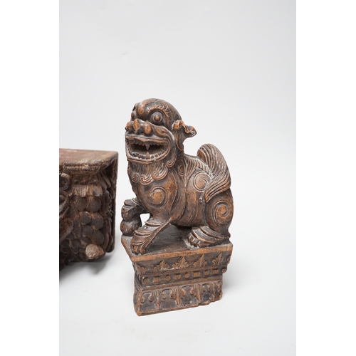 1350 - A carved South East Asian hardwood temple lion and an Indian wall bracket (2) tallest 23cm