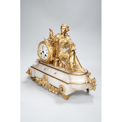 1354 - A late 19th century French gilt metal and onyx clock mounted with the figure of Industry holding a l... 