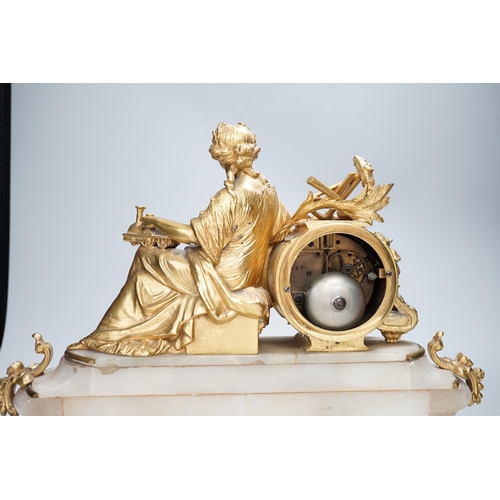 1354 - A late 19th century French gilt metal and onyx clock mounted with the figure of Industry holding a l... 