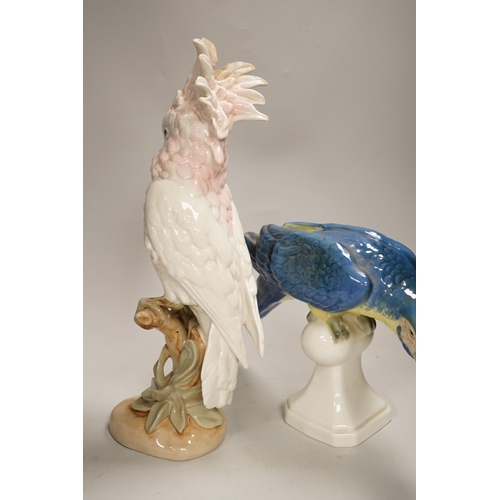 1356 - Two Royal Dux parrots and a Beswick parrot, the largest 40cm high