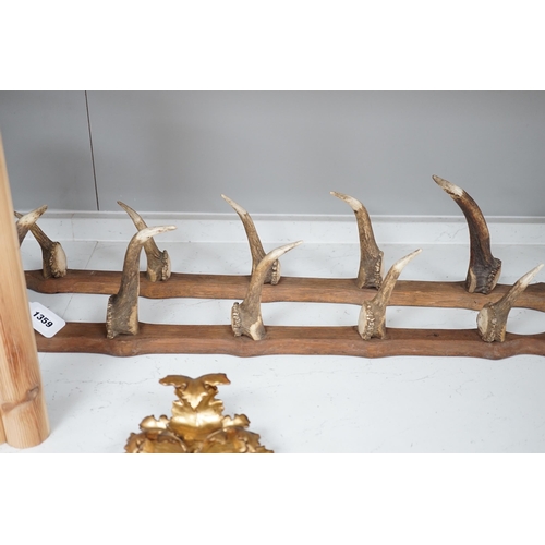 1359 - A two piece antler gun rack, 87cm high