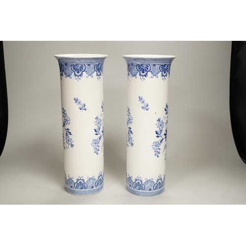 1362 - A pair of Delft blue and white cylindrical vases, each decorated with boats, 30cm high