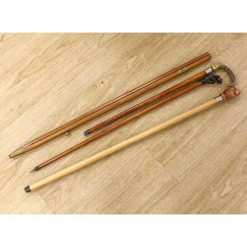 1384 - Four canes / walking sticks including a horse measuring stick and a military pace stick