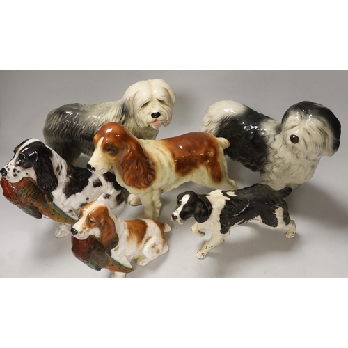 1388 - A group of six ceramic models of dogs including Royal Doulton and Beswick