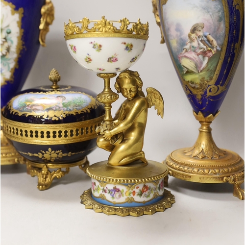 1391 - A pair of Sevres style porcelain ormolu mounted vases, a similar putti stemmed cup and a bowl and co... 