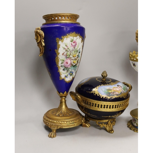 1391 - A pair of Sevres style porcelain ormolu mounted vases, a similar putti stemmed cup and a bowl and co... 