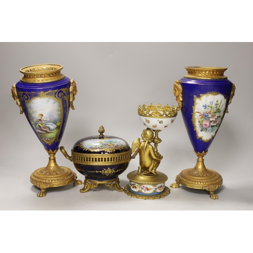 1391 - A pair of Sevres style porcelain ormolu mounted vases, a similar putti stemmed cup and a bowl and co... 