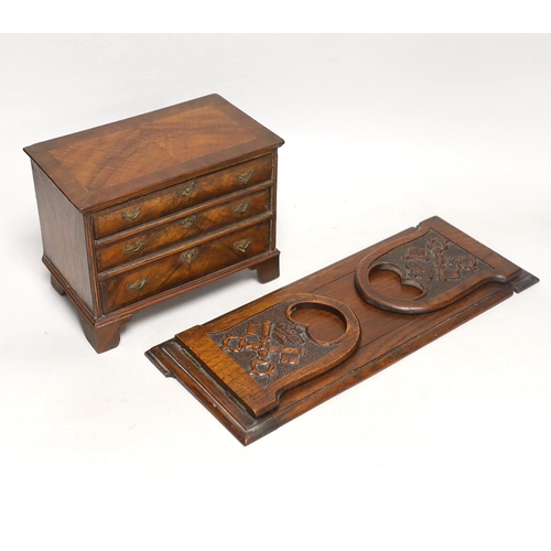 1396 - A miniature walnut chest of drawers and a bookslide, relating to the fire at York Minster, 34cm wide... 