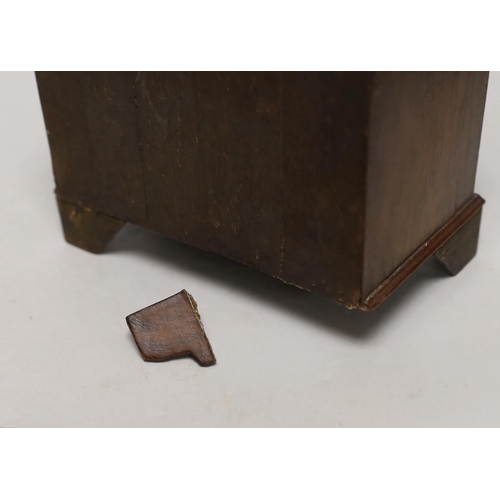 1396 - A miniature walnut chest of drawers and a bookslide, relating to the fire at York Minster, 34cm wide... 