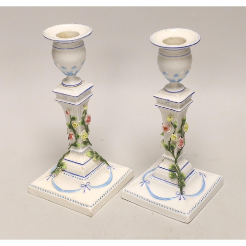 1404 - A pair of German porcelain candlesticks, marked JR, with applied floral decoration, 18cm