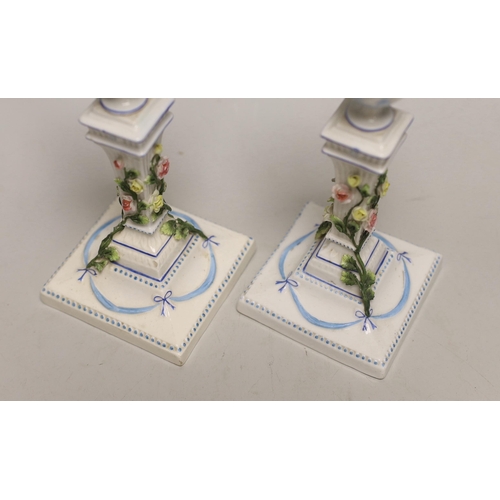 1404 - A pair of German porcelain candlesticks, marked JR, with applied floral decoration, 18cm