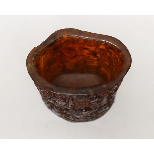 1405 - A Chinese amber coloured moulded plastic brush pot, 13.5cm