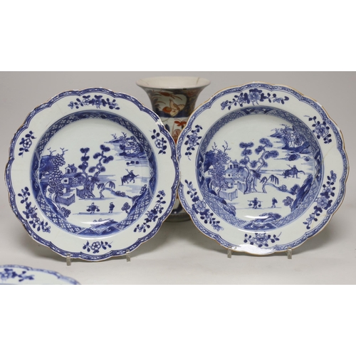 1410 - Three 18th century Chinese blue and white plates and an Imari flared vase, 22cm