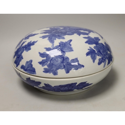 1422 - A Chinese blue and white circular box and cover, 27cm diameter