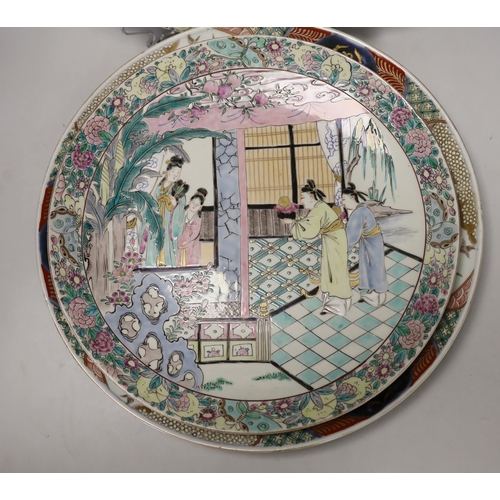 1445 - A pair of Japanese famille rose chargers and an Imari charger, largest 40.5cm diameter