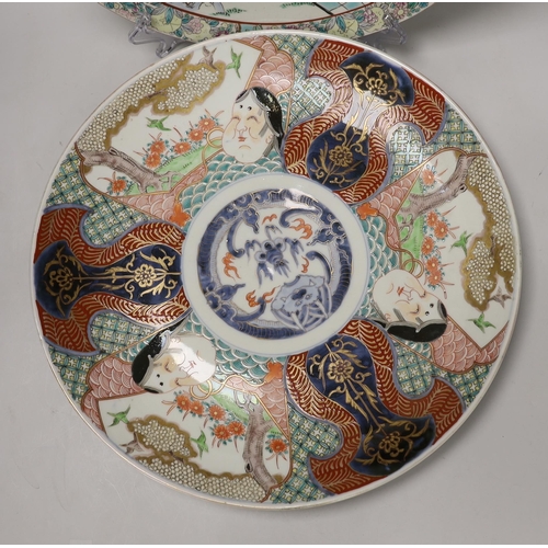 1445 - A pair of Japanese famille rose chargers and an Imari charger, largest 40.5cm diameter