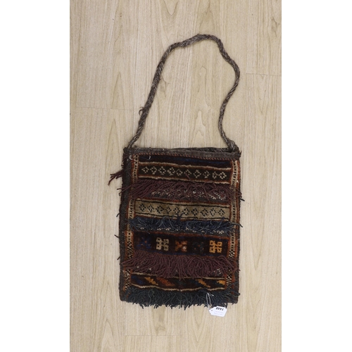 1448 - A Caucasian salt carpet bag with tasseling, 38cm x 48cm