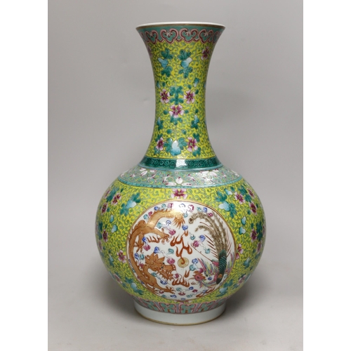 1462 - A large Chinese yellow ground dragon & phoenix vase, 39cm high