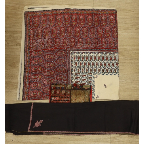 1463 - A 19th century Indian mirrored square, a printed summer paisley shawl and a black wool and embroider... 