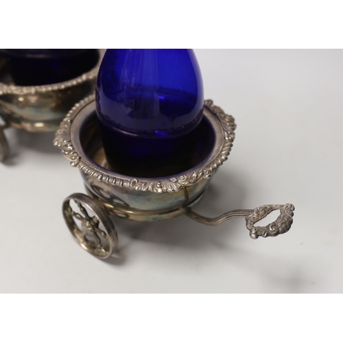 1469 - A Victorian plated twin coaster trolley and two Bristol blue decanters, trolley 43cm long