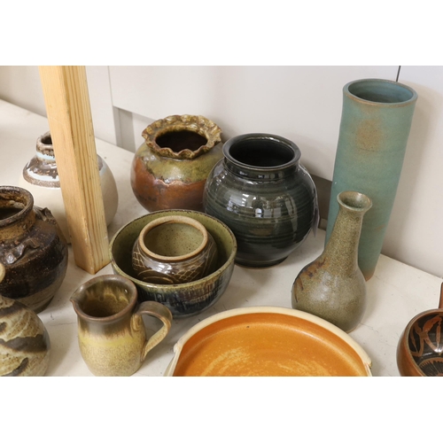 1473 - A large collection of mixed studio pottery vases, bowls and dishes,