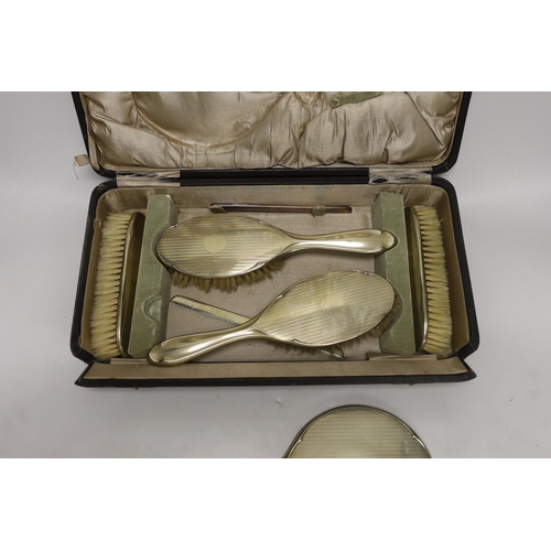 1484 - A cased 1930's six piece plated mirror and brush set.