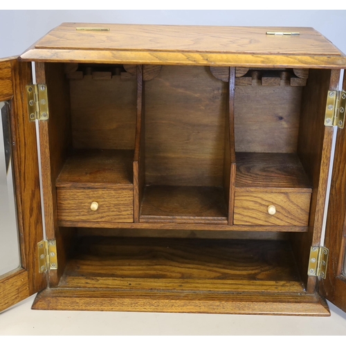 1496 - An oak cased smokers cabinet with bone handles and brass mounts, 31cm high