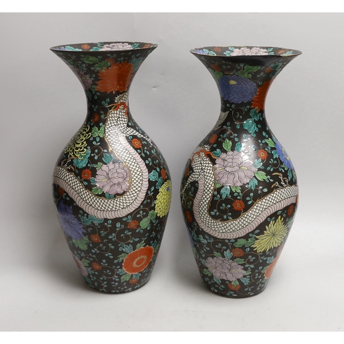 1528 - A pair of Japanese black ground dragon vases, 37cm