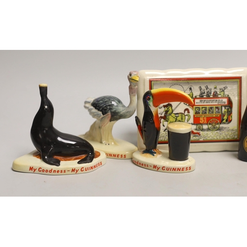 1538 - Six Carltonware Guinness advertising models, three related bottles and a rectangular box