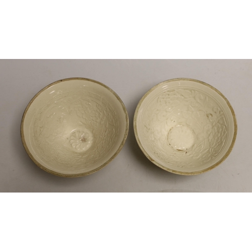 1545 - A pair of Chinese Ding type relief moulded bowls, 12cm in diameter