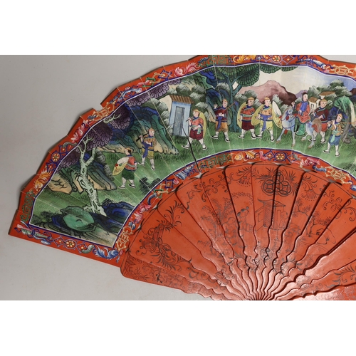 1561 - A Chinese hand painted figural fan with applied ivory faces and red lacquered guards, and boxed both... 