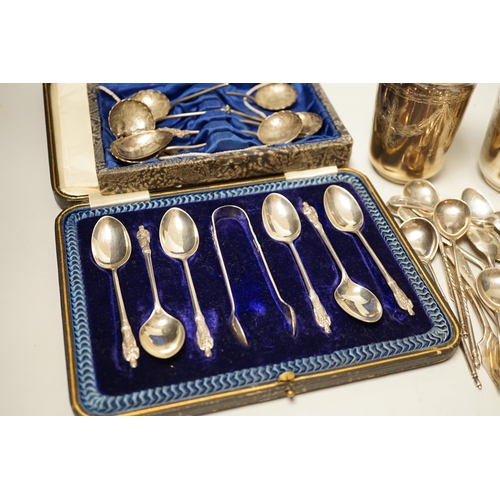 1802 - A pair of engraved white metal tumblers, stamped 'K980', four Russian 84 zolotnik spoon, a cased set... 