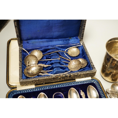 1802 - A pair of engraved white metal tumblers, stamped 'K980', four Russian 84 zolotnik spoon, a cased set... 